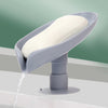 Self-draining leaf-shaped soap dish for kitchen or bathroom use.