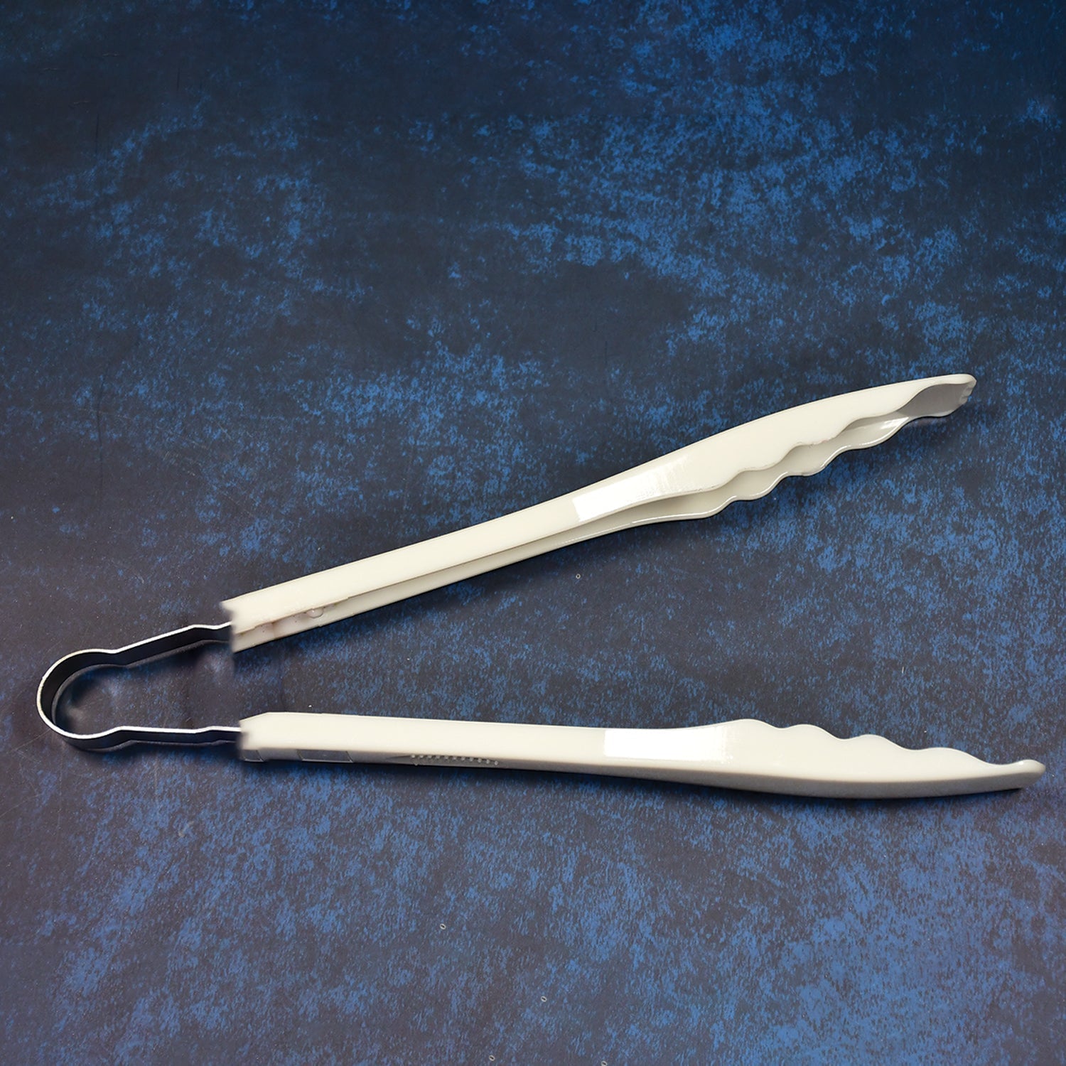 Kitchen tongs with easy grip handles.