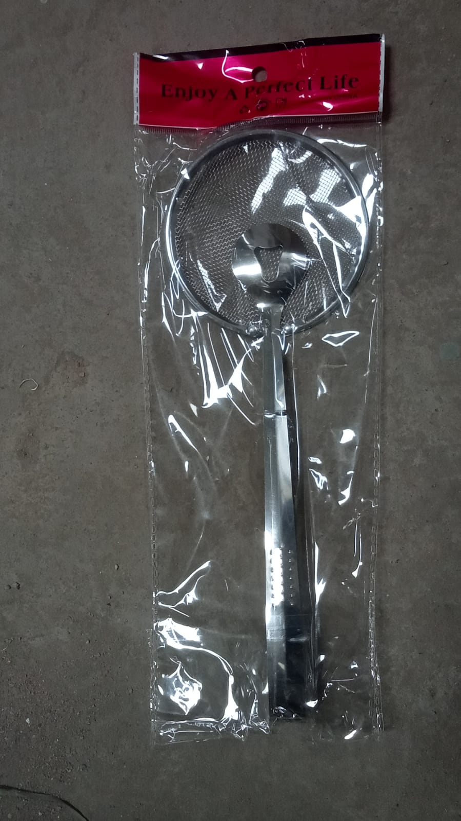 Multi-functional stainless steel filter spoon with clip.