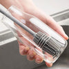 Multi-purpose cleaning brush for kitchen use.